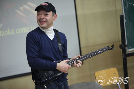 日本著名吉他演奏家吉岗靖高先生来访我院